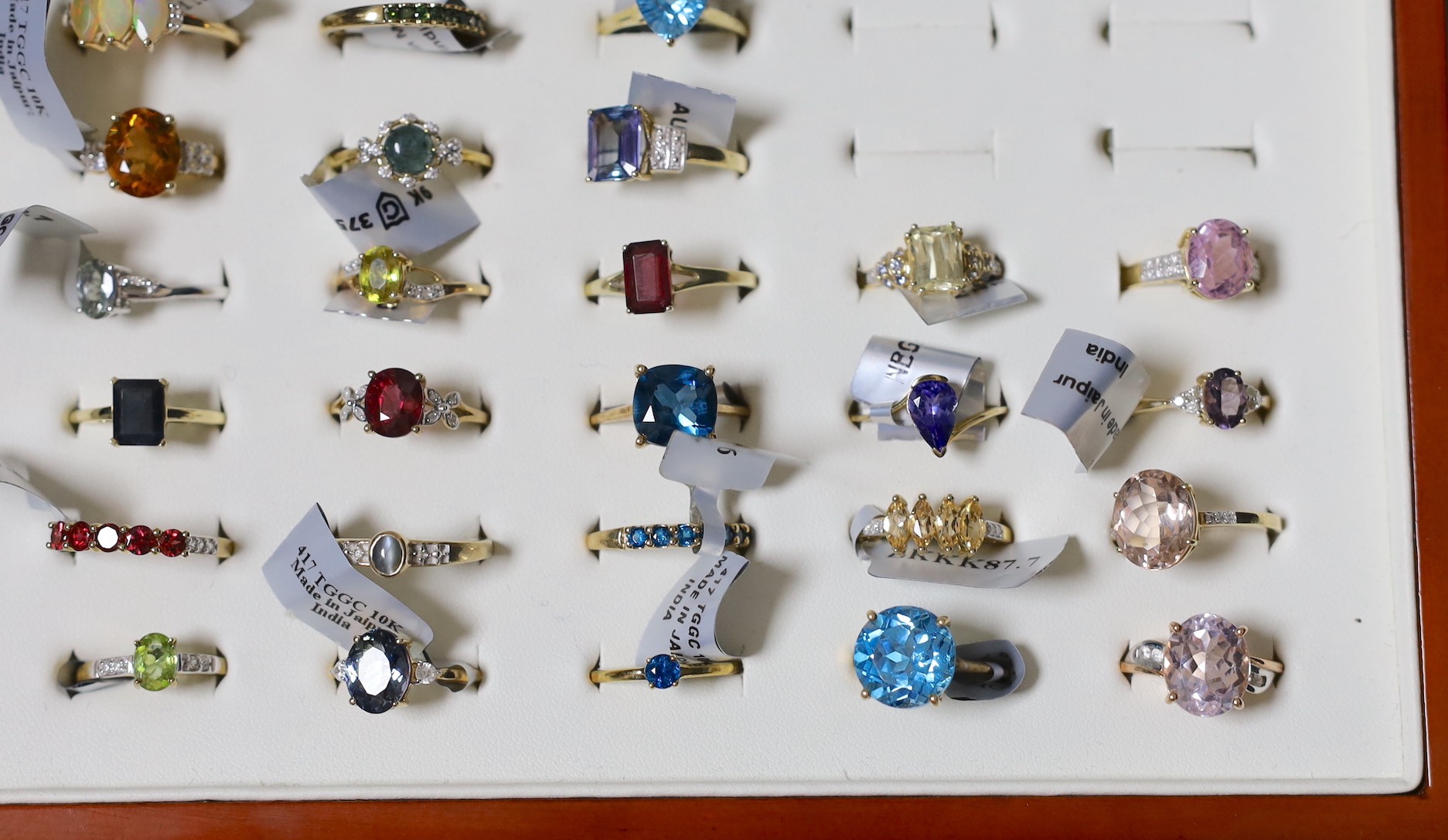 A collection of thirty four modern 9ct gold and gem set dress rings, four similar 18ct gold and gem set rings, four 14ct gold and gem set rings and three 925 rings.